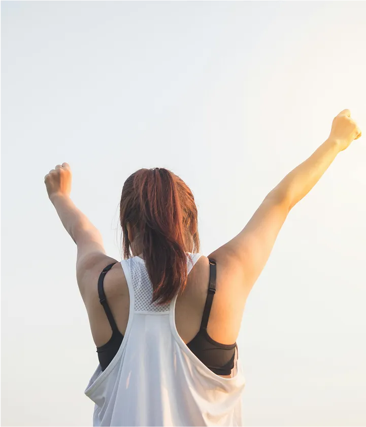 woman raising her arms