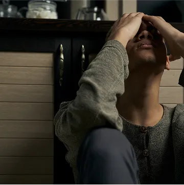 a man seated on the floor