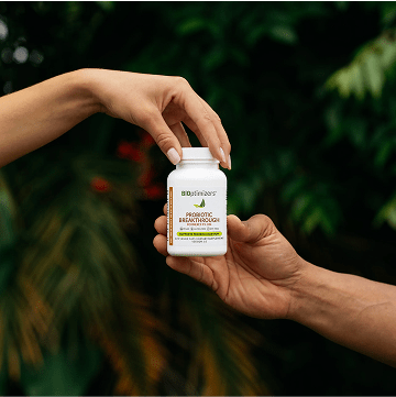 a person holding a probiotic breakthrough bottle