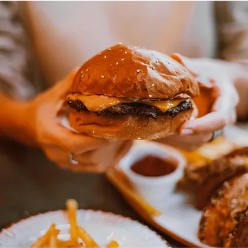 a person with a hamburger