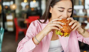 girl-eating-burger.webp