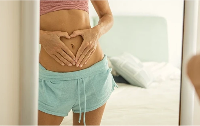 woman holding her stomach